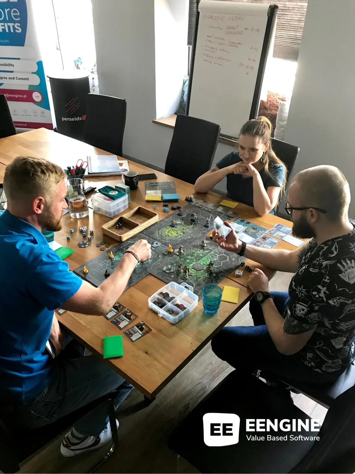 EENGINE team playing a board game in the office