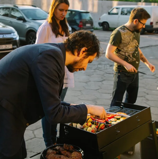 EENGINE team gathering around a bonfire